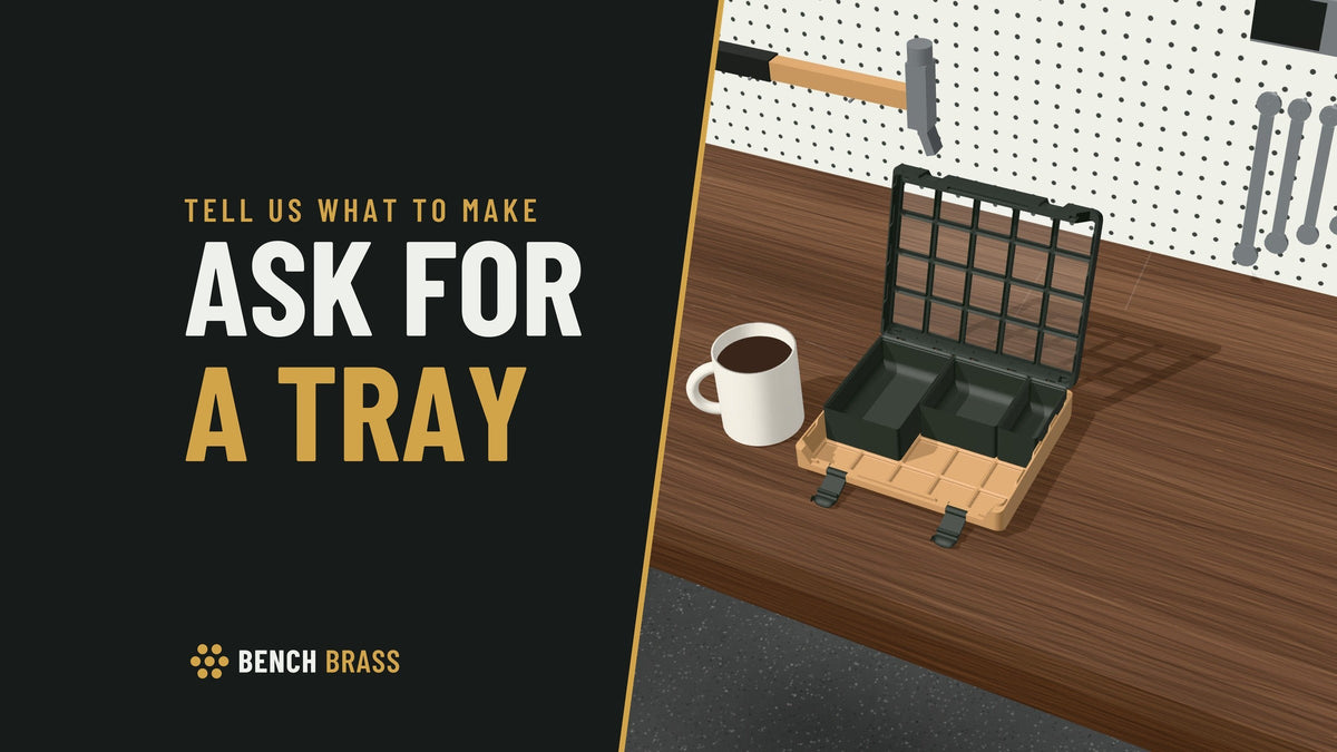 Ask for a tray: an Army Beige Day case with three Bay bins in and its front squares empty, beside a coffee mug on a walnut workbench